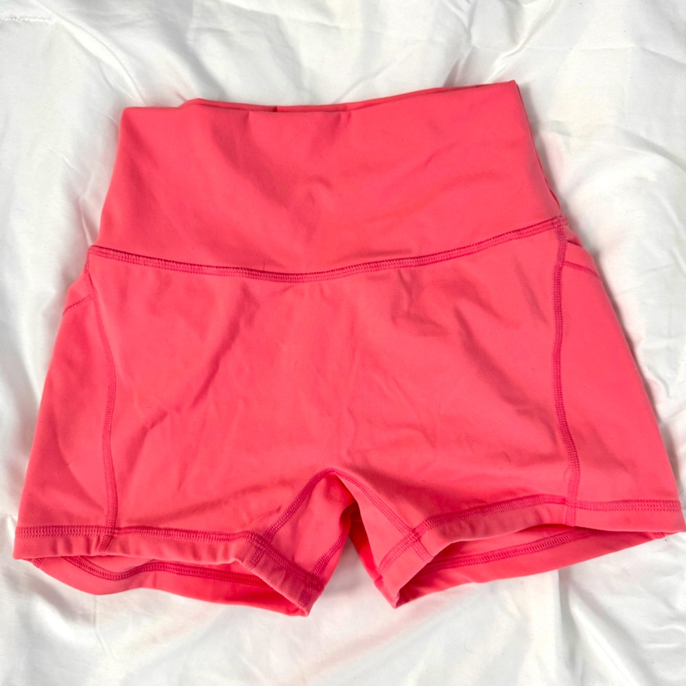 Violate the dress code coral shorts. Beautiful color! Size medium. Never worn